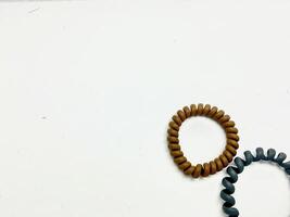 Two Spiral Plastic rubber hair band on the white background photo