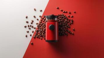 Modern Red Coffee Grinder with Coffee Beans on Red and White Background - High-Quality Kitchen Appliance Image photo