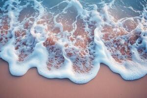 Aerial View of Gentle Ocean Waves Crashing on Sandy Beach at Sunset with Soft Pastel Colors photo