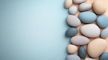 Smooth Multicolored Pebbles on a Pastel Background - Minimalist Nature Composition photo