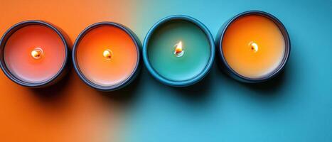 Vibrant Colorful Candles in a Row on Split Orange and Blue Background with Soft Glow photo