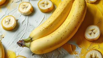 Fresh Ripe Bananas and Sliced Pieces on Artistic Background with Yellow and Gray Textures photo