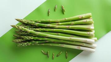 Fresh Green Asparagus Spears on a Green and Light Blue Background - Healthy and Organic Vegetables photo