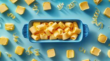 Assorted Butter Curls in Blue Dish on Light Blue Background with Shadows photo
