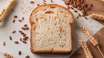 Freshly Baked Whole Wheat Bread Slice with Grains and Wheat Ears on Rustic White Background photo