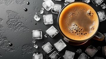 Refreshing Iced Coffee in a Glass Mug with Ice Cubes on a Dark Background photo