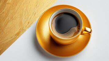 Golden Coffee Cup with Black Coffee on White and Gold Textured Background photo