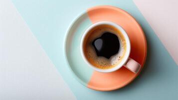 Aerial View of a Cup of Coffee in a Colorful Cup and Saucer on a Modern Geometric Background photo