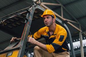 Caucasian engineer using a laptop in a factory. man working in plastics factory. photo
