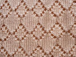 top view weave patterned surface beige knitted wool fabric closeup texture background photo