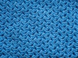 top view weave patterned surface blue knitted wool fabric closeup texture background photo