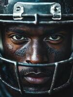 American football player wearing helmet is looking determined photo