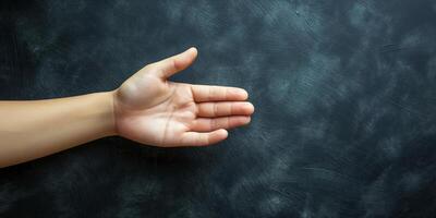 Human Hand Gesturing Open Palm on Dark Textured Background photo
