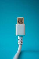 CloseUp of USB Cable Plug on Blue Background for Technology and Connectivity Concepts photo