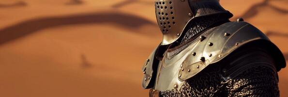 Medieval Knight in Armor Standing in Desert Landscape with Sand Dunes photo