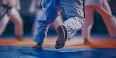 Martial Arts Training Session with Karate Practitioners in Uniforms on Mat photo