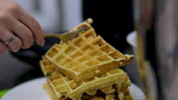 Stack waffles on a pile pile of waffles, close-up, on a plate video