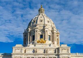 Front view of the dome and gold Quadriga statue of the Capitol building in the state of Minnesota in Saint Paul, MN photo