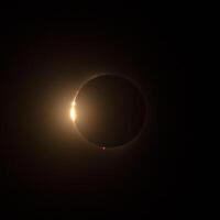 HD images of the solar eclipse in 2024 with the moon just about to finally cover the sun for totality. photo