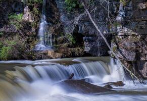 Small waterfall cascade on rocks by Valley Falls State Park near Fairmont in West Virginia on a colorful and bright spring day photo