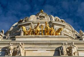 Front view of the dome and gold Quadriga statue of the Capitol building in the state of Minnesota in Saint Paul, MN photo