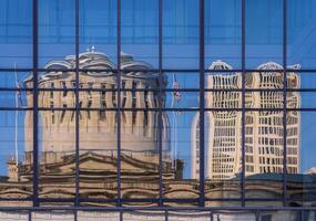 Reflection of the Ohio state Capitol building in the windows of an office building across the street in Columbus, OH photo