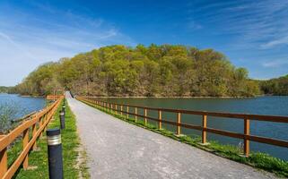 Warm light on the park at Cheat Lake near Morgantown West Virginia on a beautiful calm spring morning. The new leaves start to open on the trees photo