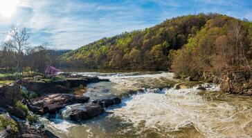 Aerial view of Valley Falls State Park near Fairmont in West Virginia on a spring day with redbud blossoms on the trees photo