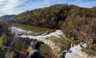 Aerial view of Valley Falls State Park near Fairmont in West Virginia on a spring day with redbud blossoms on the trees photo