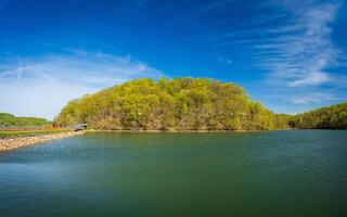Warm light on the park at Cheat Lake near Morgantown West Virginia on a beautiful calm spring morning. As the new leaves start to open on the trees photo