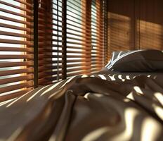 Modern bedroom with sunlight filtering through wooden blinds in a cozy space photo