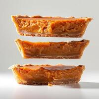 Three slices of pie stacked on top of each other photo