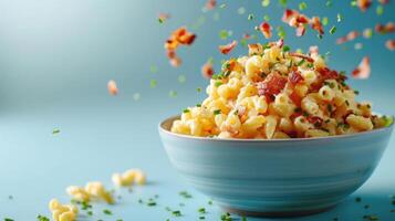 Macaroni and cheese garnished with crumbled bacon bits, finely chopped chives, and parsley flakes, photo