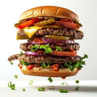 a large hamburger with lettuce, tomato, onion and cheese photo