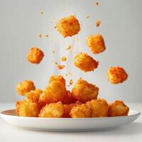 a white bowl filled with fried food on top of a table photo