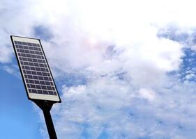 Mini solar panels or photovoltaic. Sky background. Concept using green and clean energy for environment. Renewable energy, Natural power from sunlight to generate electricity. Sustainable energy. photo