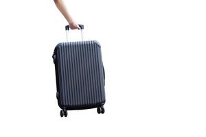 Closeup of woman hand pulling black luggage isolated on white background. Concept, suitcases or traveling bags. Main items for loading things or personal stuff , when go travelling. Easy to carry. photo
