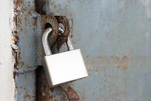 Door is locked by metal lock. Concept , security. Saving value things inside and lock it. photo