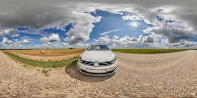 hdri 360 panorama near white car on roadside of gravel dusty road in field with blue sky and awesome clouds in equirectangular full seamless spherical projection, for VR AR content photo