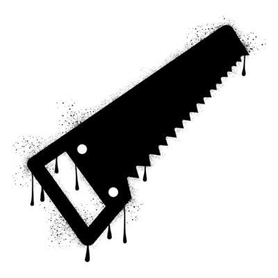 Hand saw with black spray paint graffiti