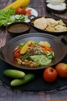 Close up of gado-gado ingredients in a plate, various vegetables and fried tempeh photo