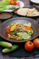 Close up of gado-gado ingredients in a plate, various vegetables and fried tempeh photo