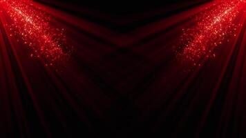 A spotlight illuminates the background of the stage. Spotlight with flying shiny bright particles. Rays of red color. Empty stage with light for product. Seamless looping 4k video
