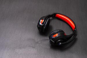 Wireless Over-Ear full size Headphones, Black leather isolated on black background with clipping path. photo