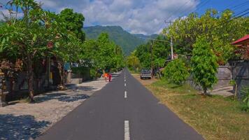Scenic Road with Lush Greenery and Mountains video