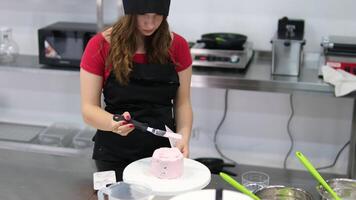 Ganache with Camembert cheese and pears Woman holding raspberry bento cake stuffed with whipped cream. Confectionery, baking and cooking concept woman making cake. process of creating video