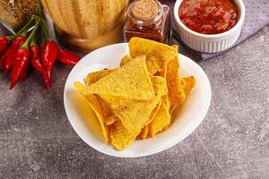 Mexican corn nachos chips with salsa photo