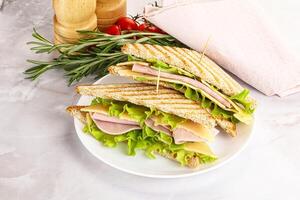 Homemade club sandwich with ham and cheese photo