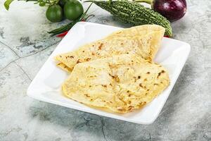 Indian tandori bread - naan with cheese photo