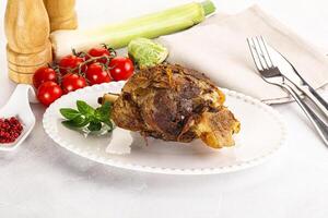 Baked Lamb shank with bone photo